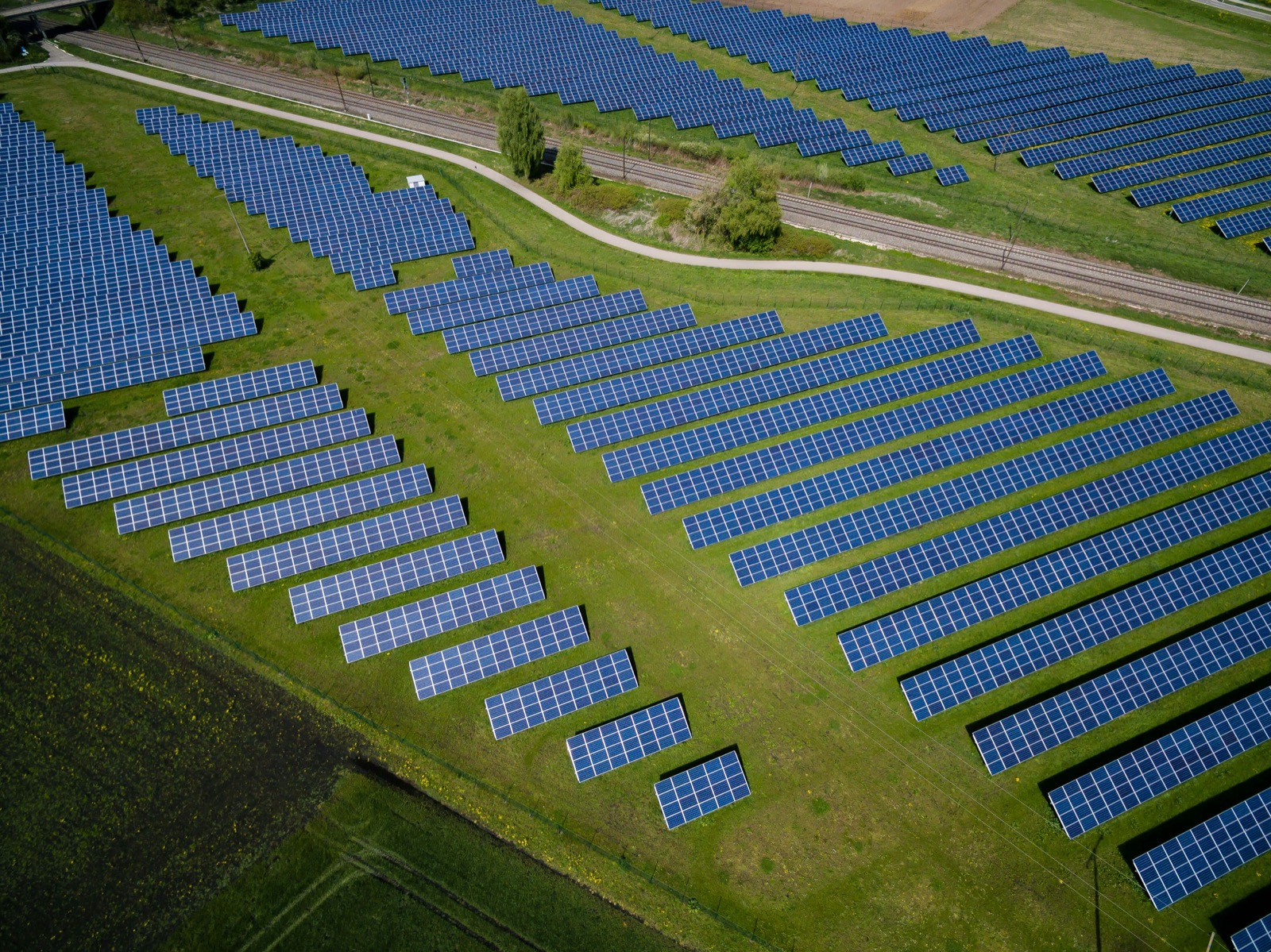 Aerial view of a solar array laid out across farmland.