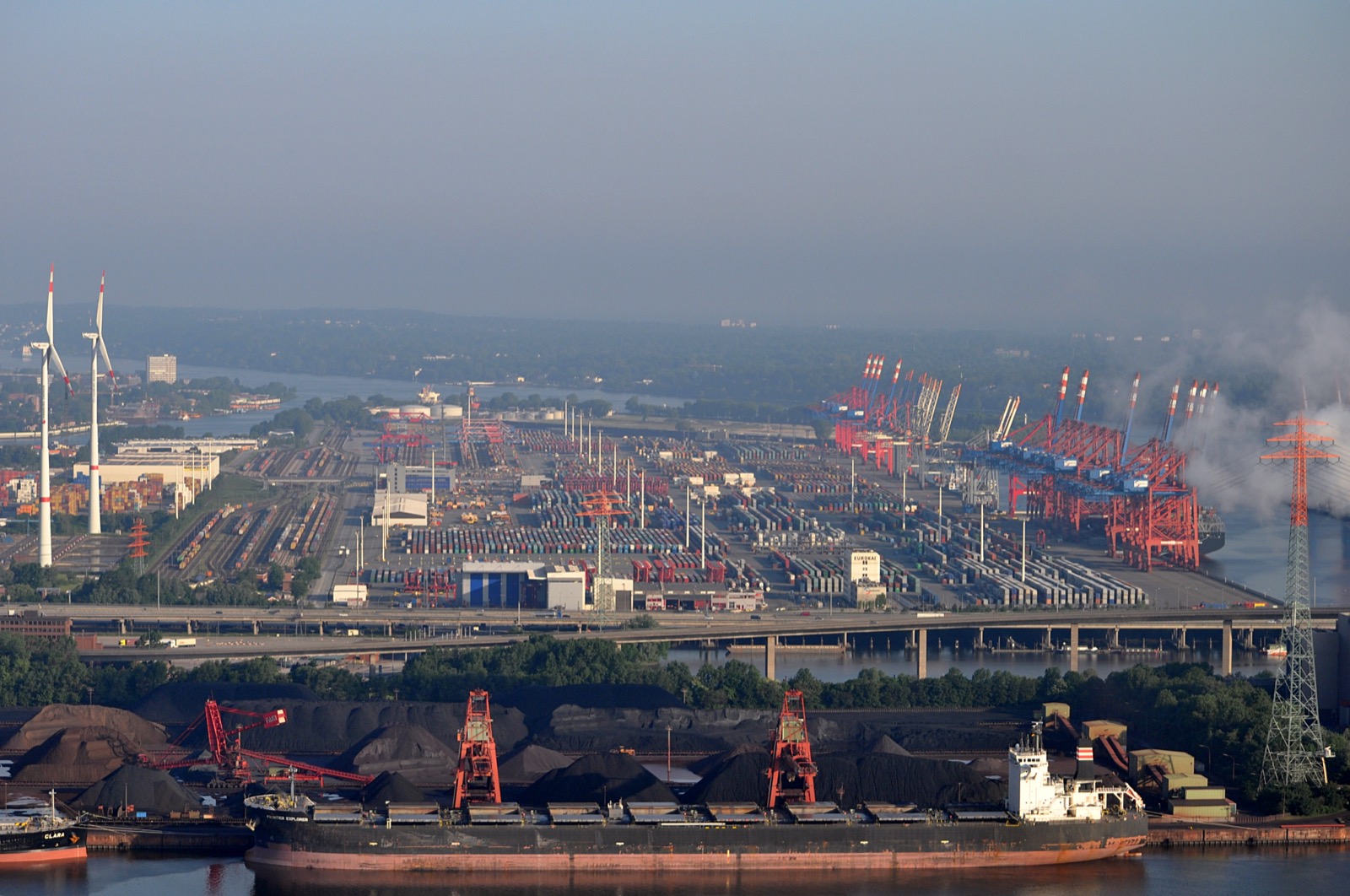 The EUROGATE container terminal at Hamburg-Waltershof from the air, stacks and quay cranes across the yard.